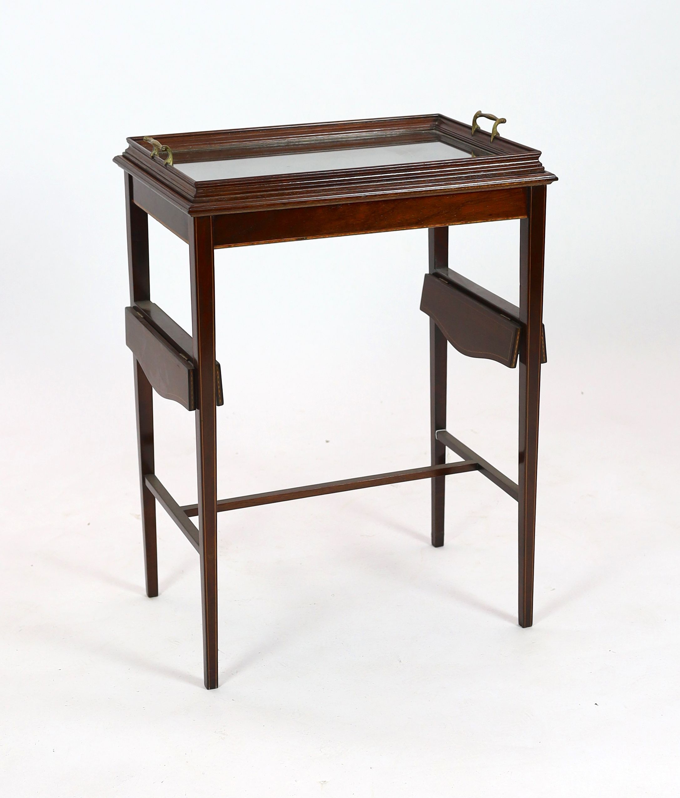 An Edwardian inlaid mahogany tray topped table, with drop flap undertier, width 56cm depth 36cm height 79cm
